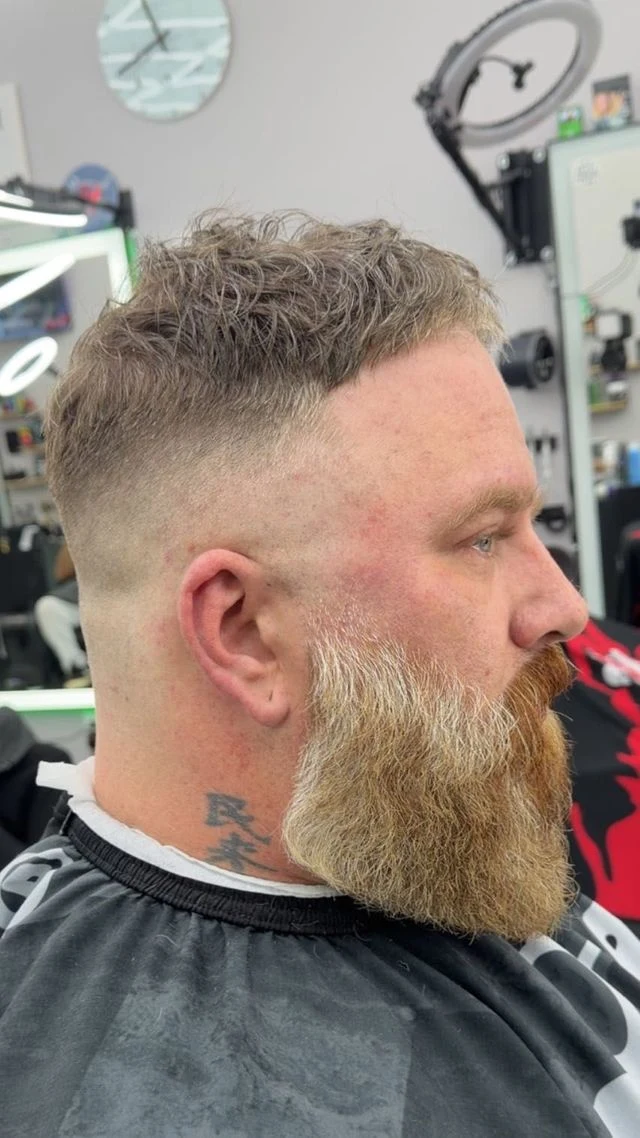 Finished side profile showing a full shaped beard and clean fade from Norie’s Booksy portfolio